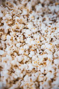 Close-up of freshly popped, light popcorn inside an iccaro vending machine.