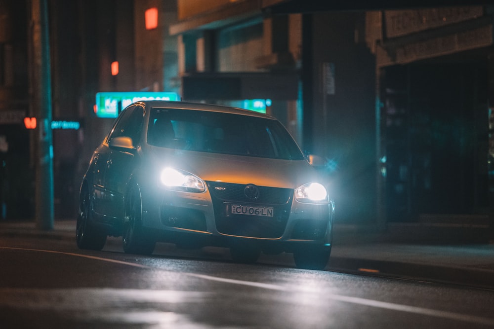 black car on the road during night time