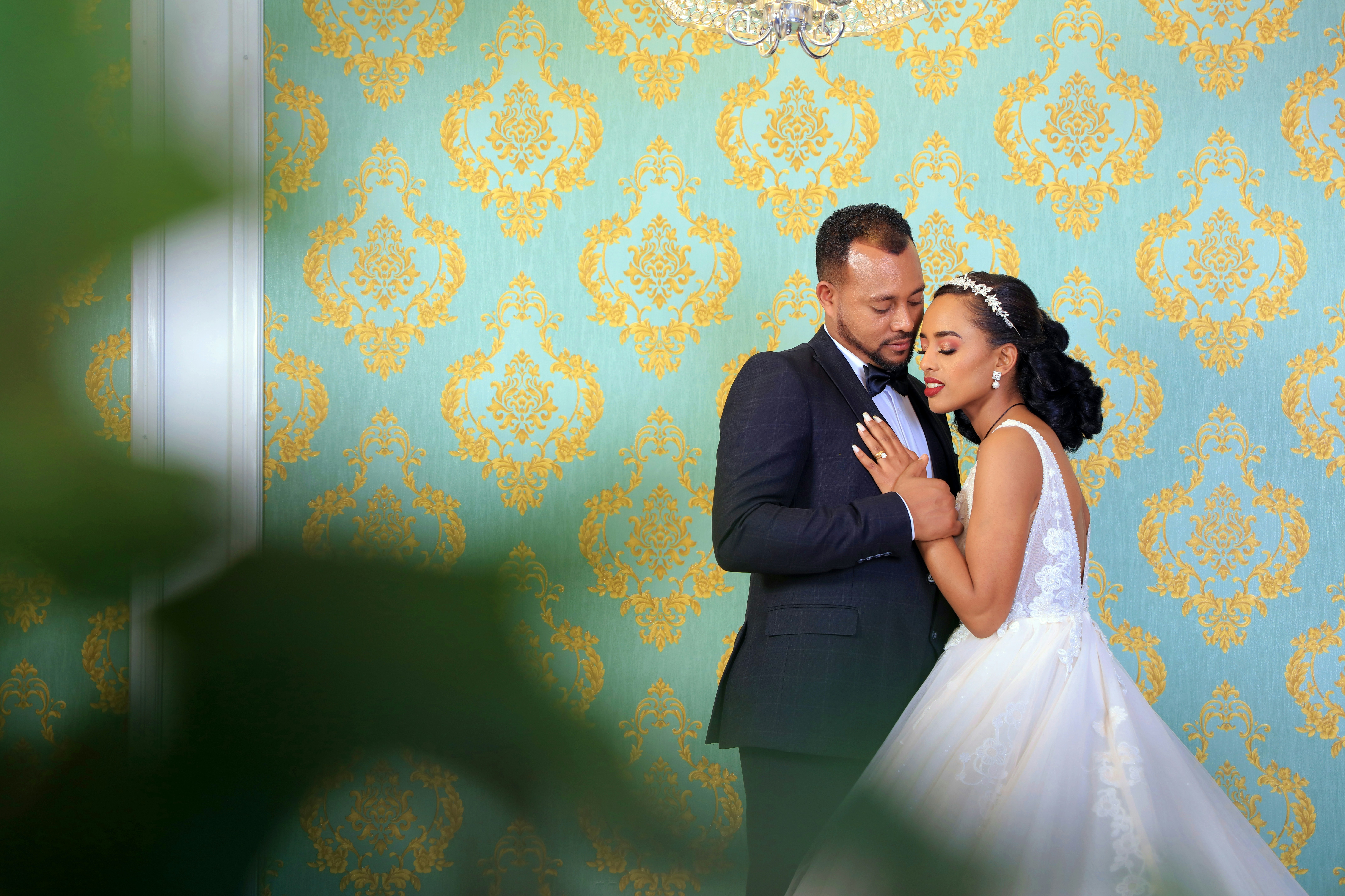 Man in black suit kissing woman in white wedding dress photo – Free ...
