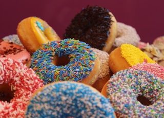 blue and pink doughnut on white textile