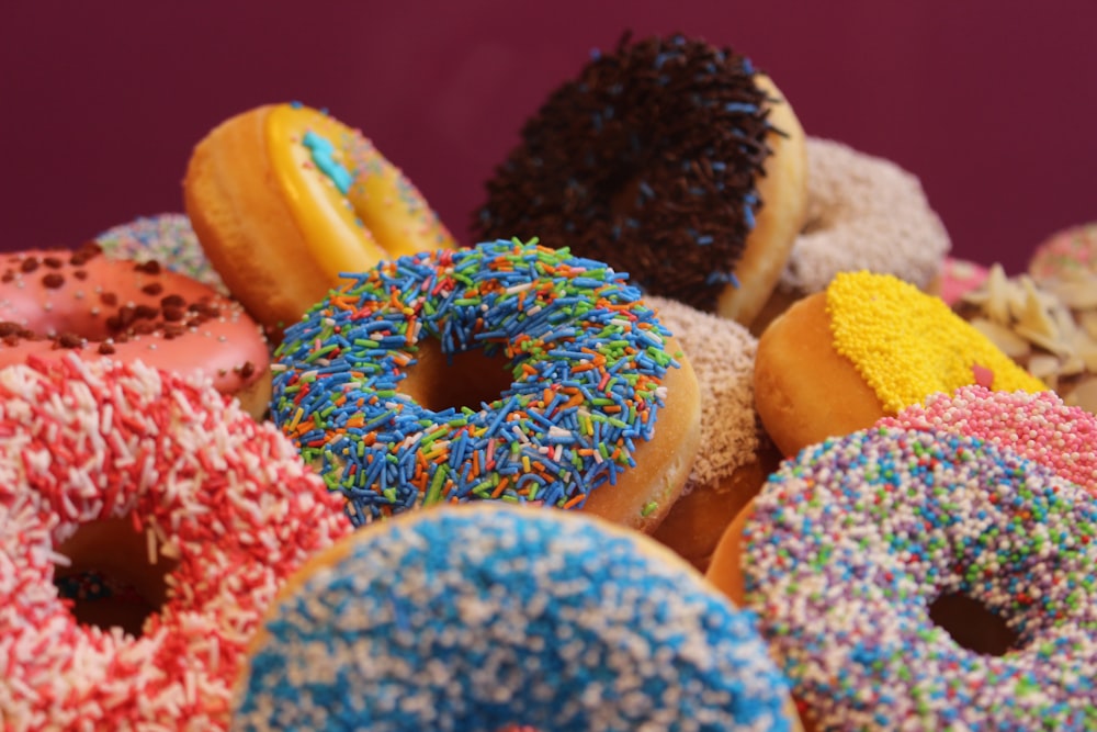 blue and pink doughnut on white textile