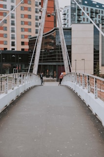 white bridge with people walking on it