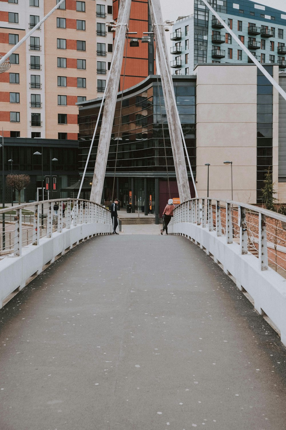 white bridge with people walking on it