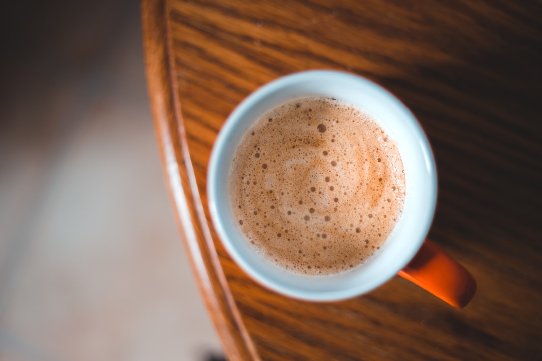 brown liquid in white ceramic mug