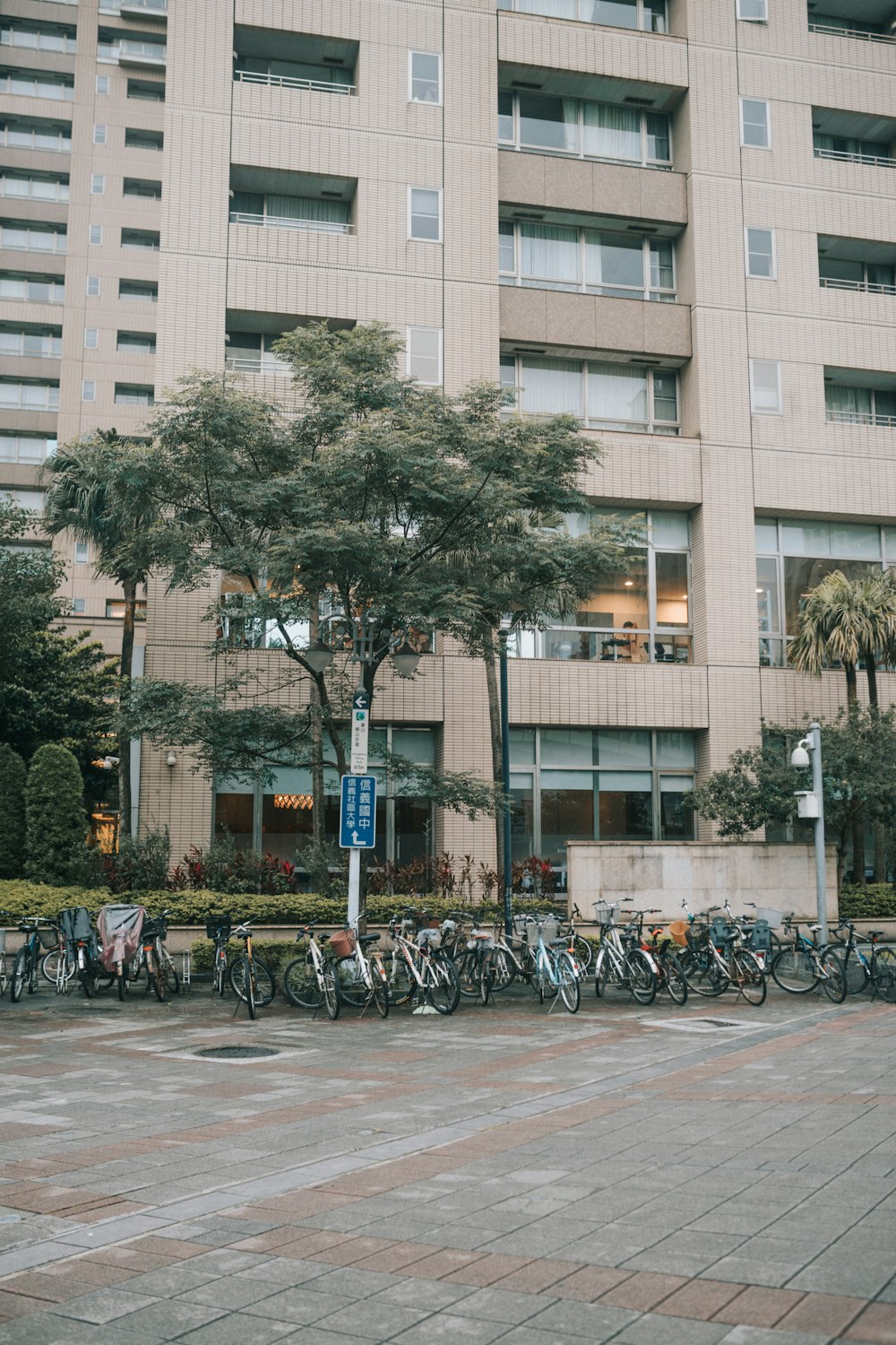 people walking on sidewalk near building during daytime