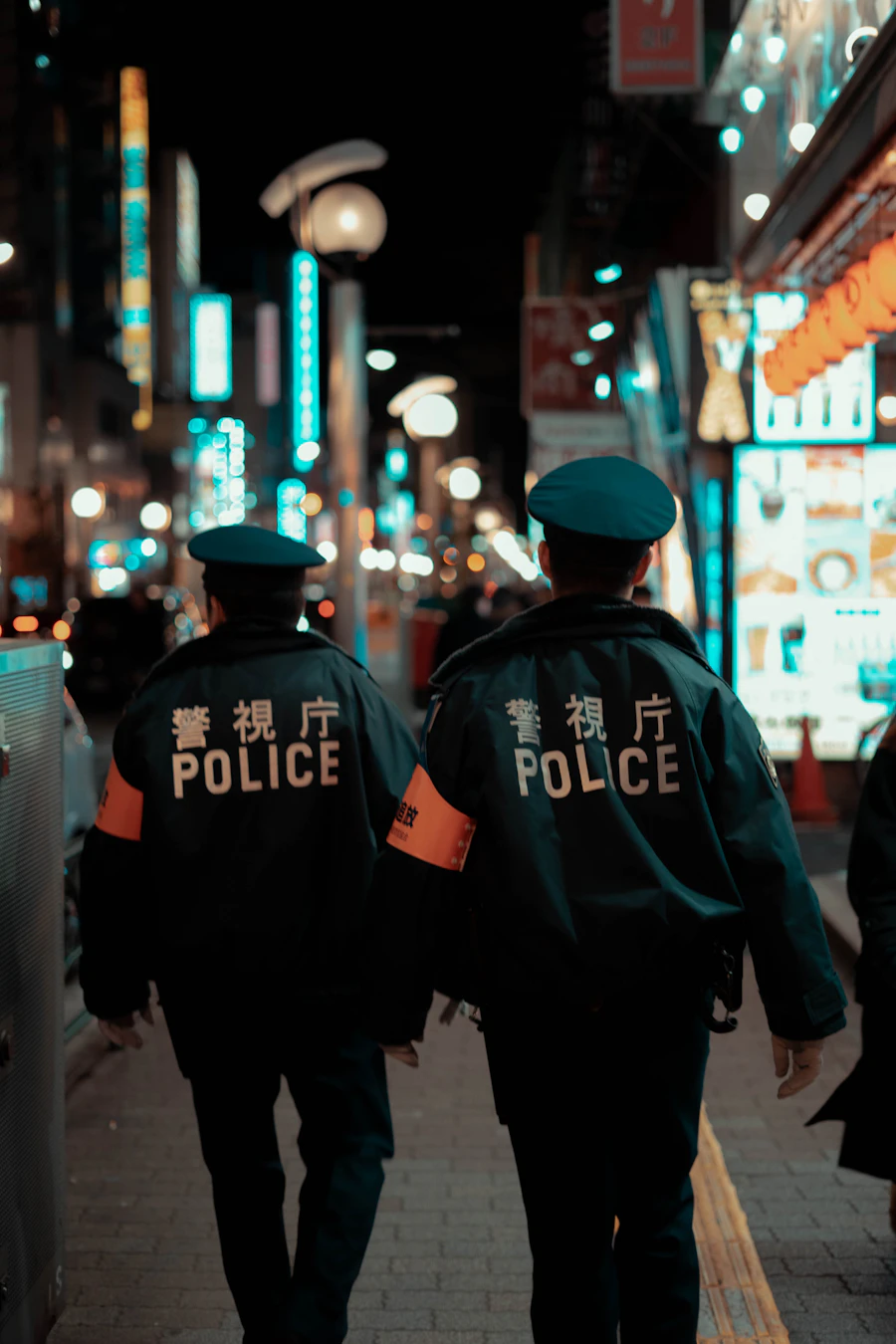 Uniformed security officer standing post at a commercial building entrance