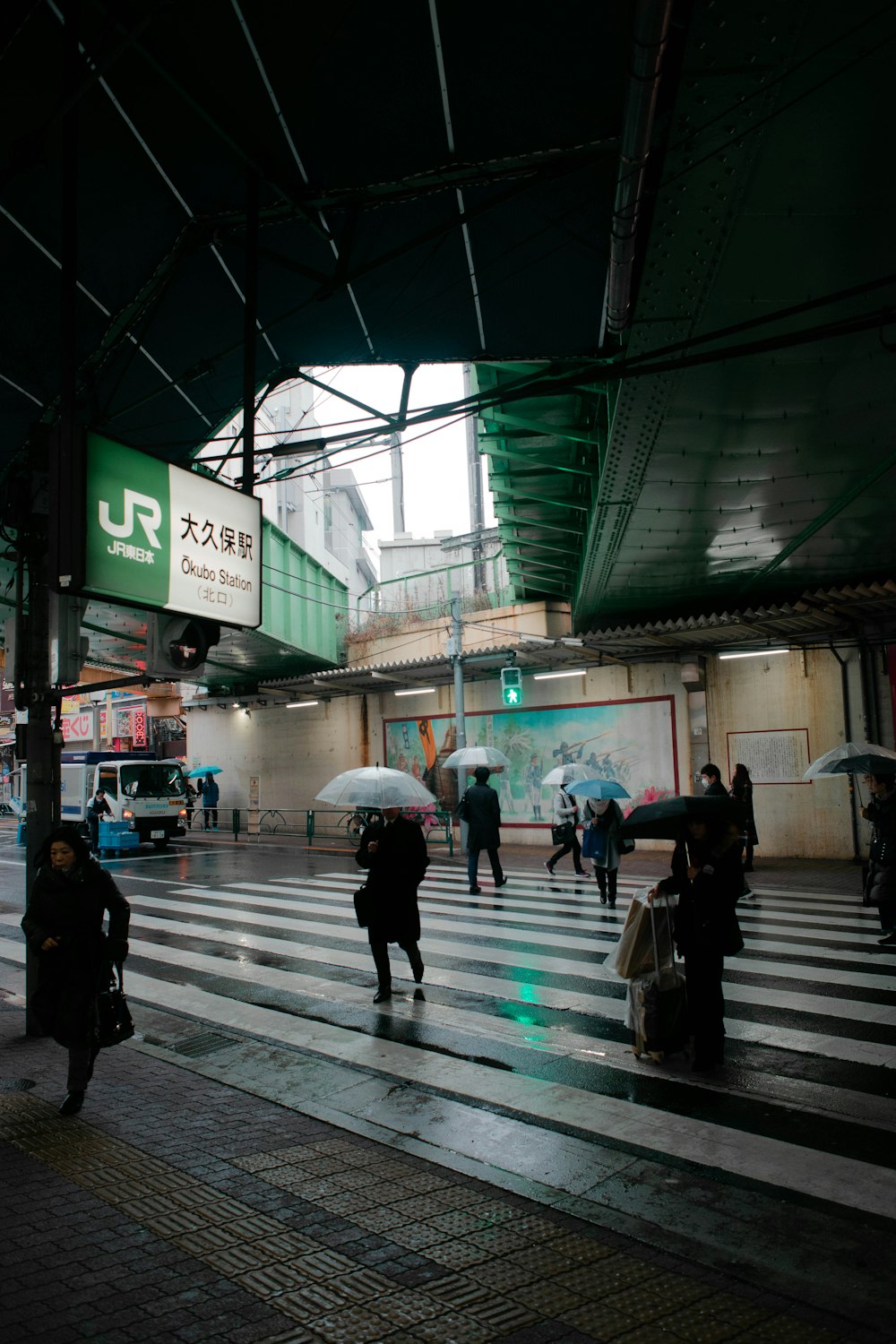 people walking on sidewalk during daytime