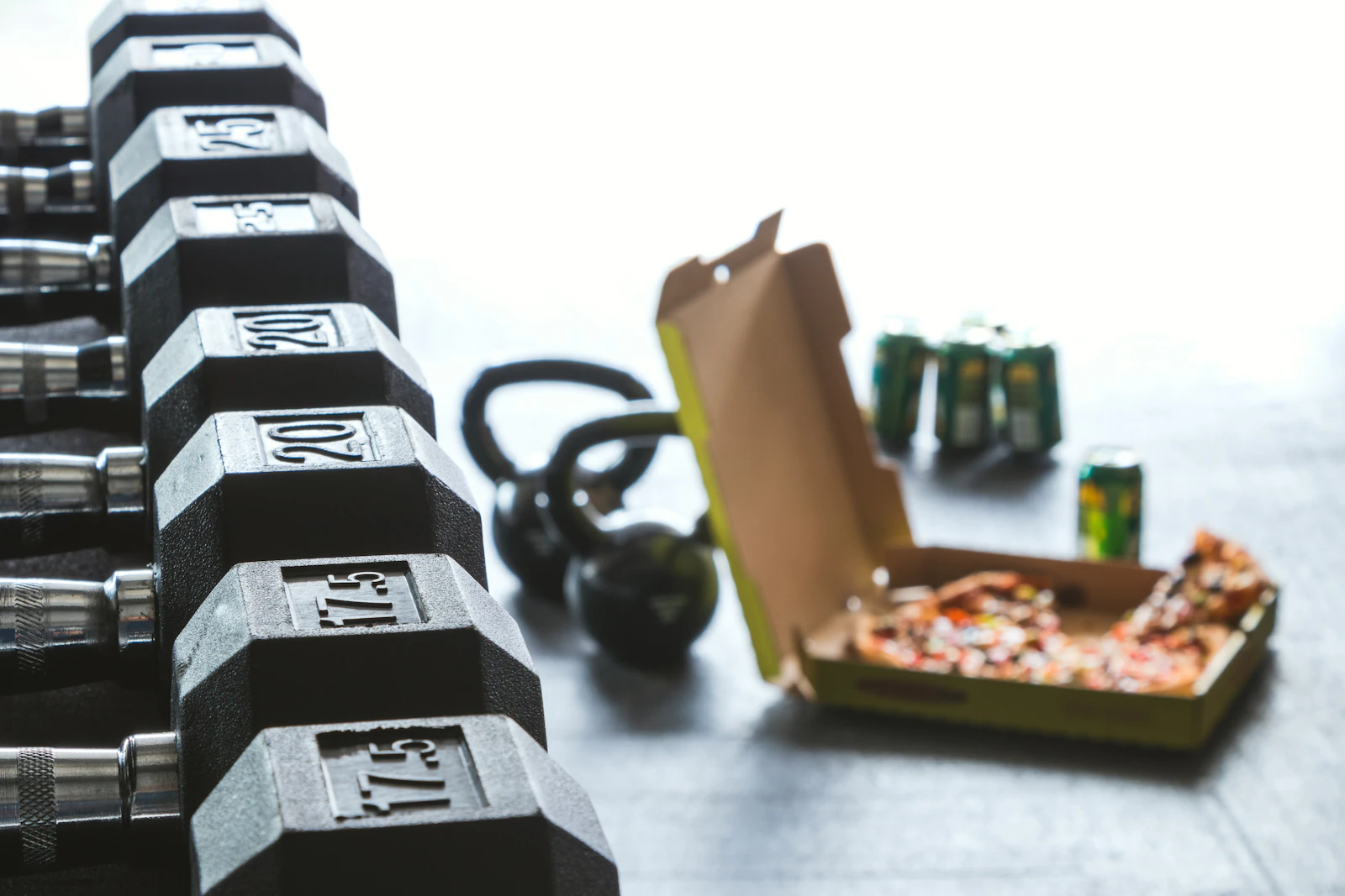 Compact adjustable dumbbells arranged in a bright home workout space