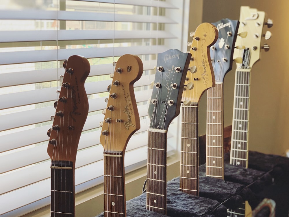 brown and white electric guitar