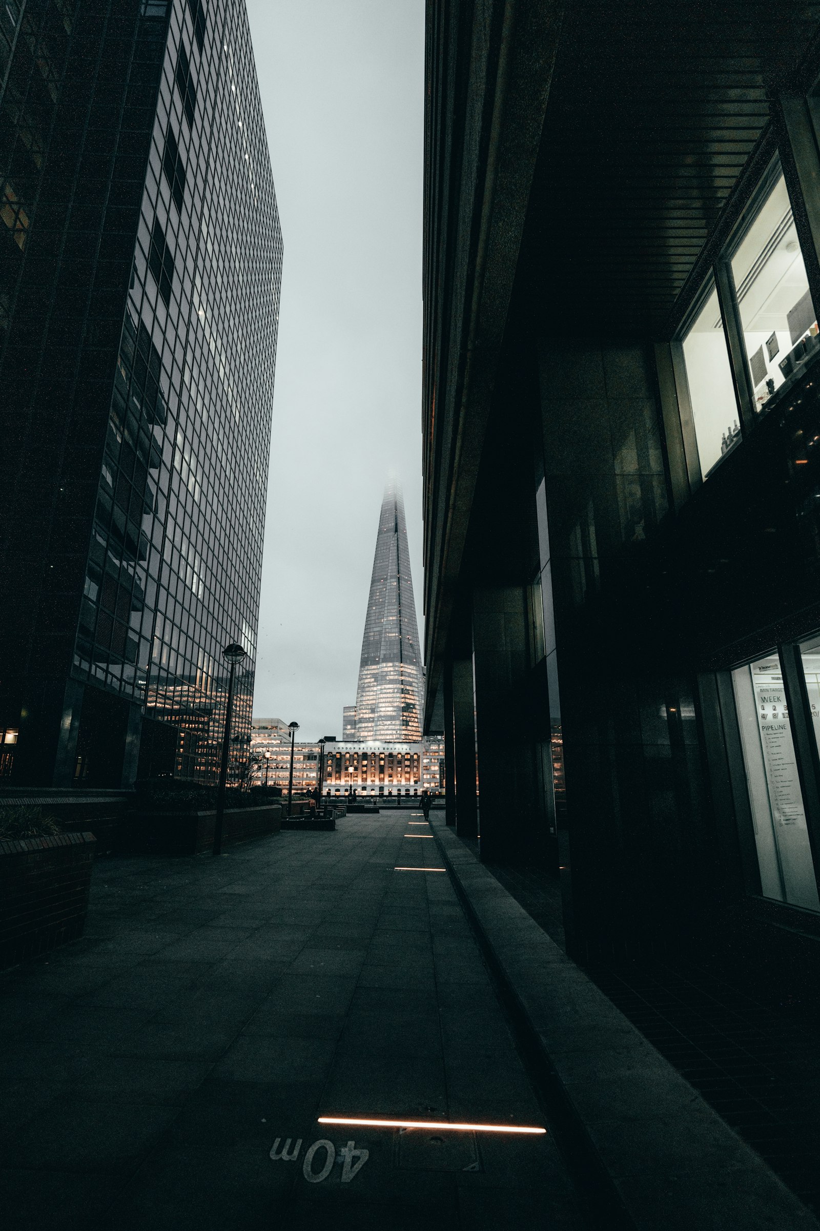 Sony a7R III + Sigma 14-24mm F2.8 DG DN Art sample photo. People walking on sidewalk photography