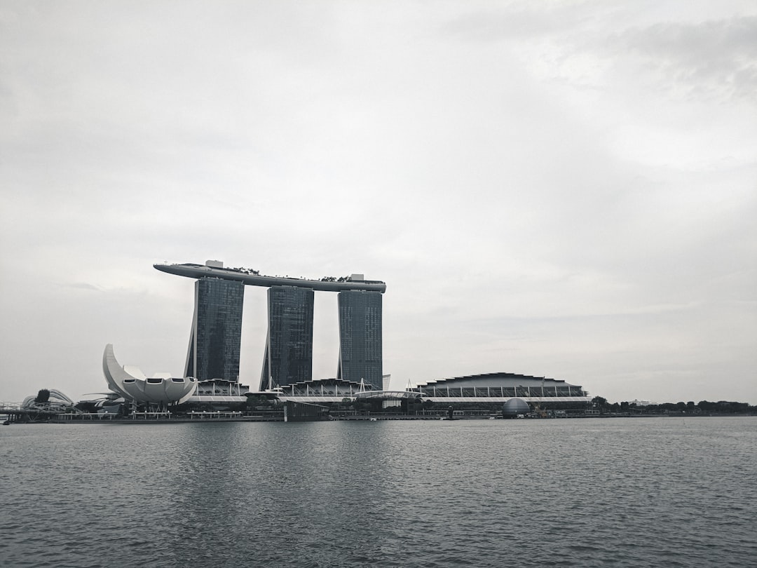 gray concrete bridge over body of water during daytime