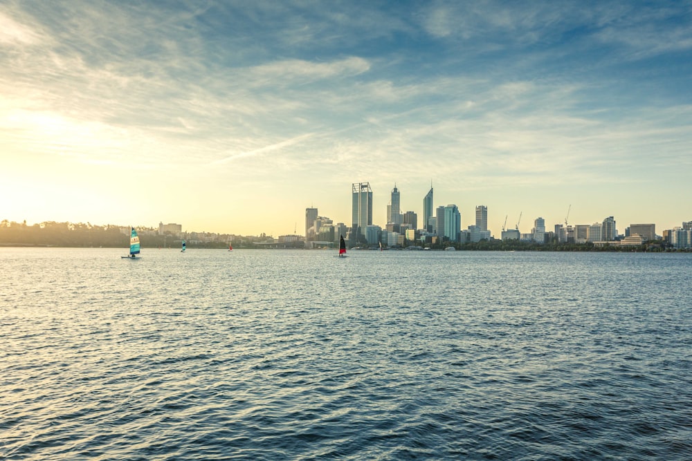 city skyline across body of water during daytime