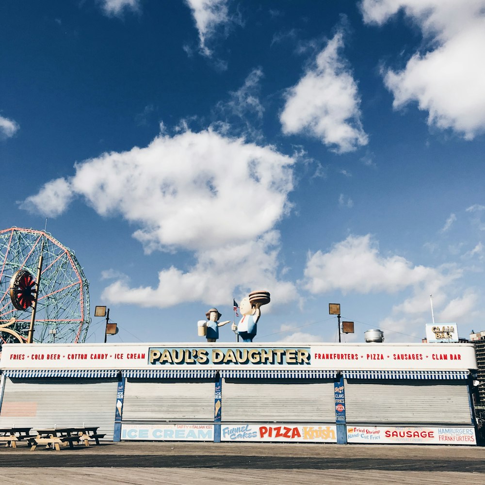 white ferris wheel under blue sky during daytime