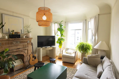 Cozy living room with a fireplace, soft lighting, and comfortable furniture.