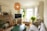 A cozy living room with a warm atmosphere and comfortable seating for family visits.