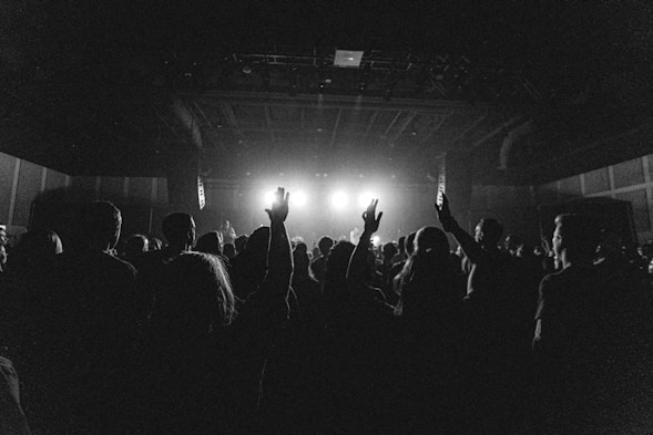 people standing on stage during night time
