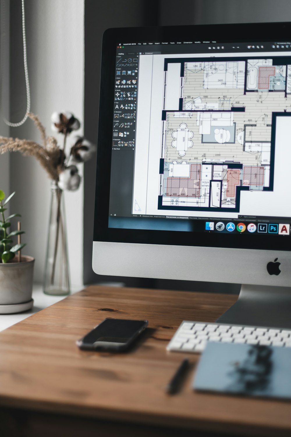 silver imac on brown wooden table