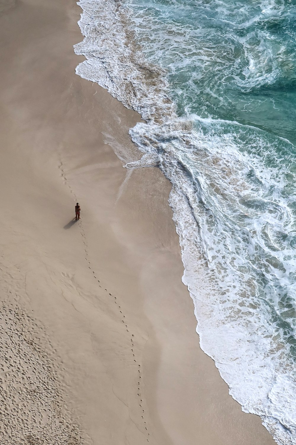 birds eye view of person surfing on sea waves