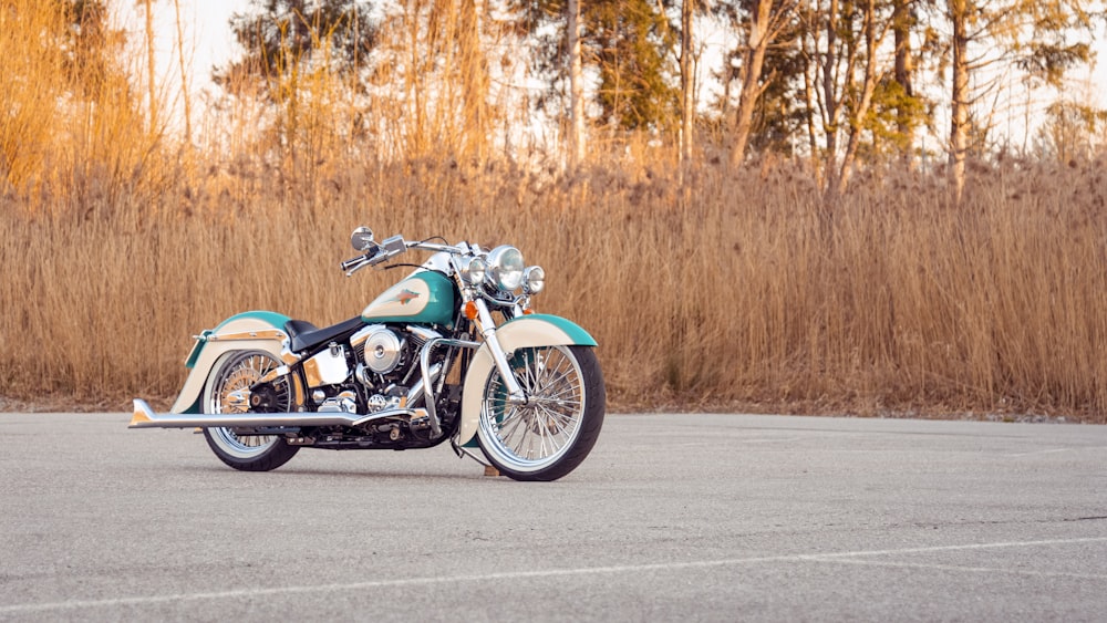 blue and black cruiser motorcycle on road during daytime