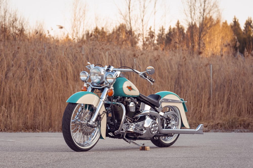 blue and black motorcycle on road during daytime