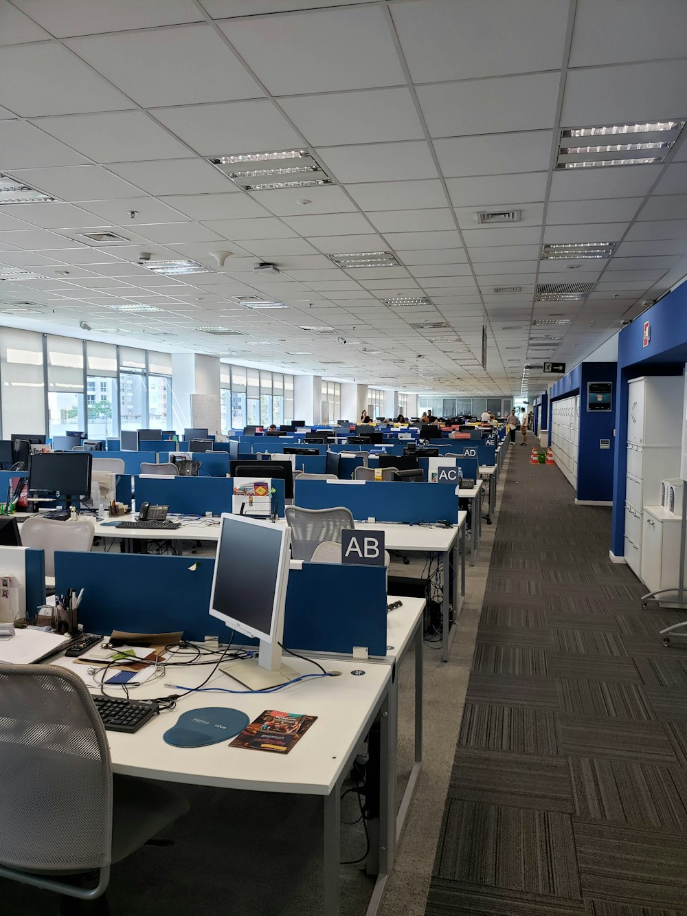 white and blue office rolling chairs