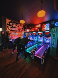 people playing arcade game inside room