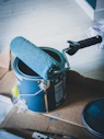 blue and white can on white table