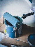 blue and white can on white table