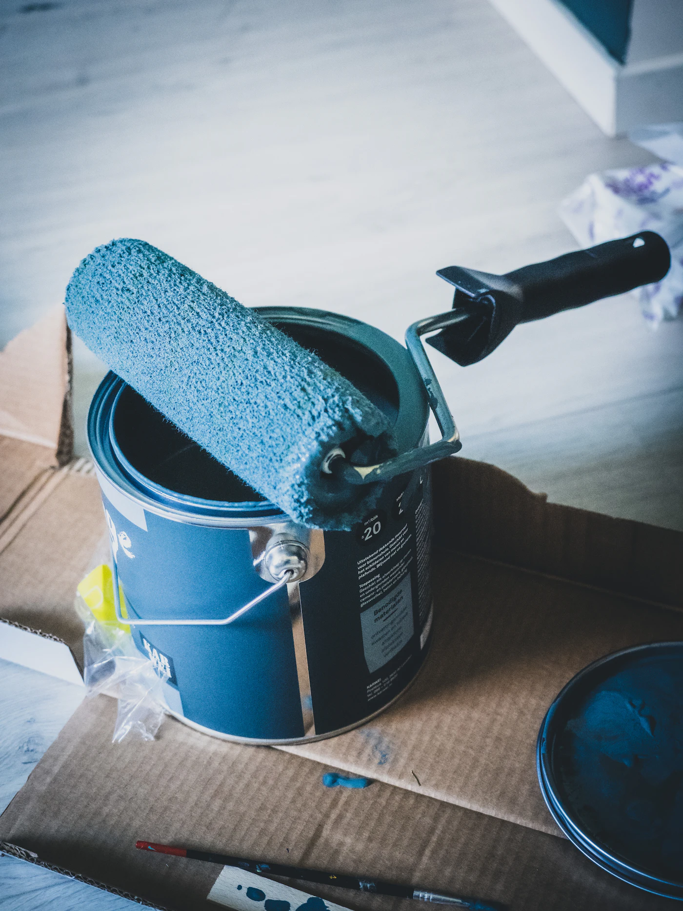 Paint can and brush ready for a new job