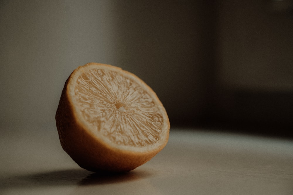 sliced lemon on white table