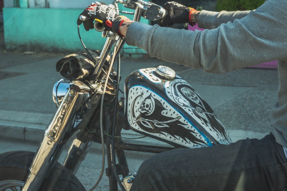 person in gray jacket riding on motorcycle