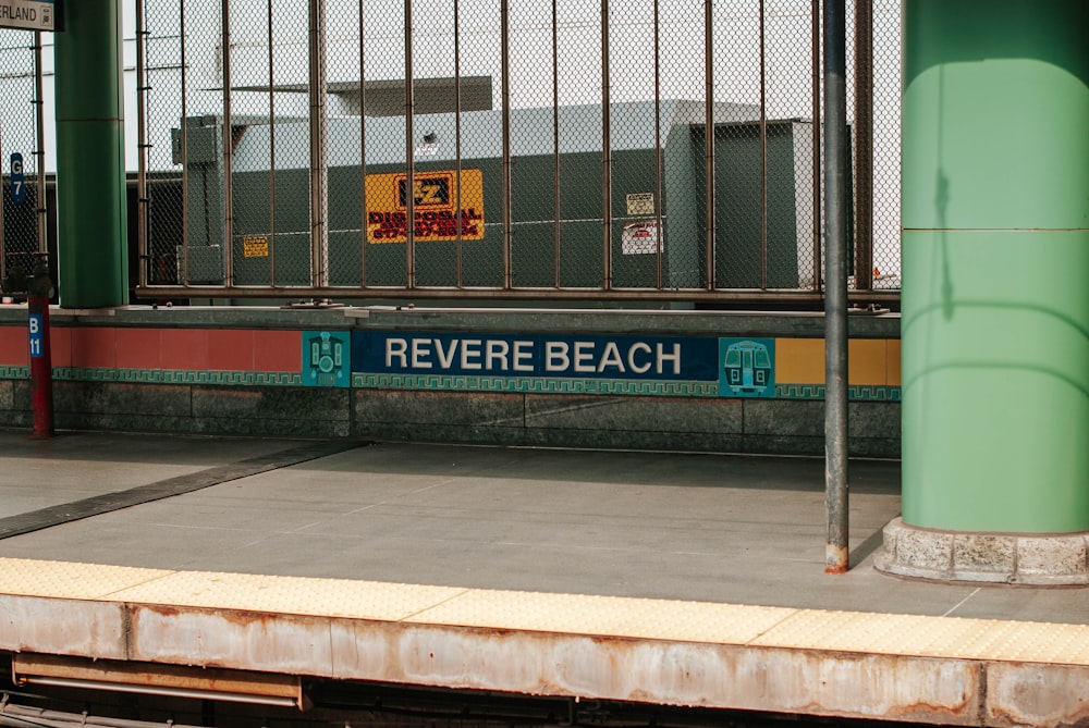 a train station with a sign that reads reverse beach