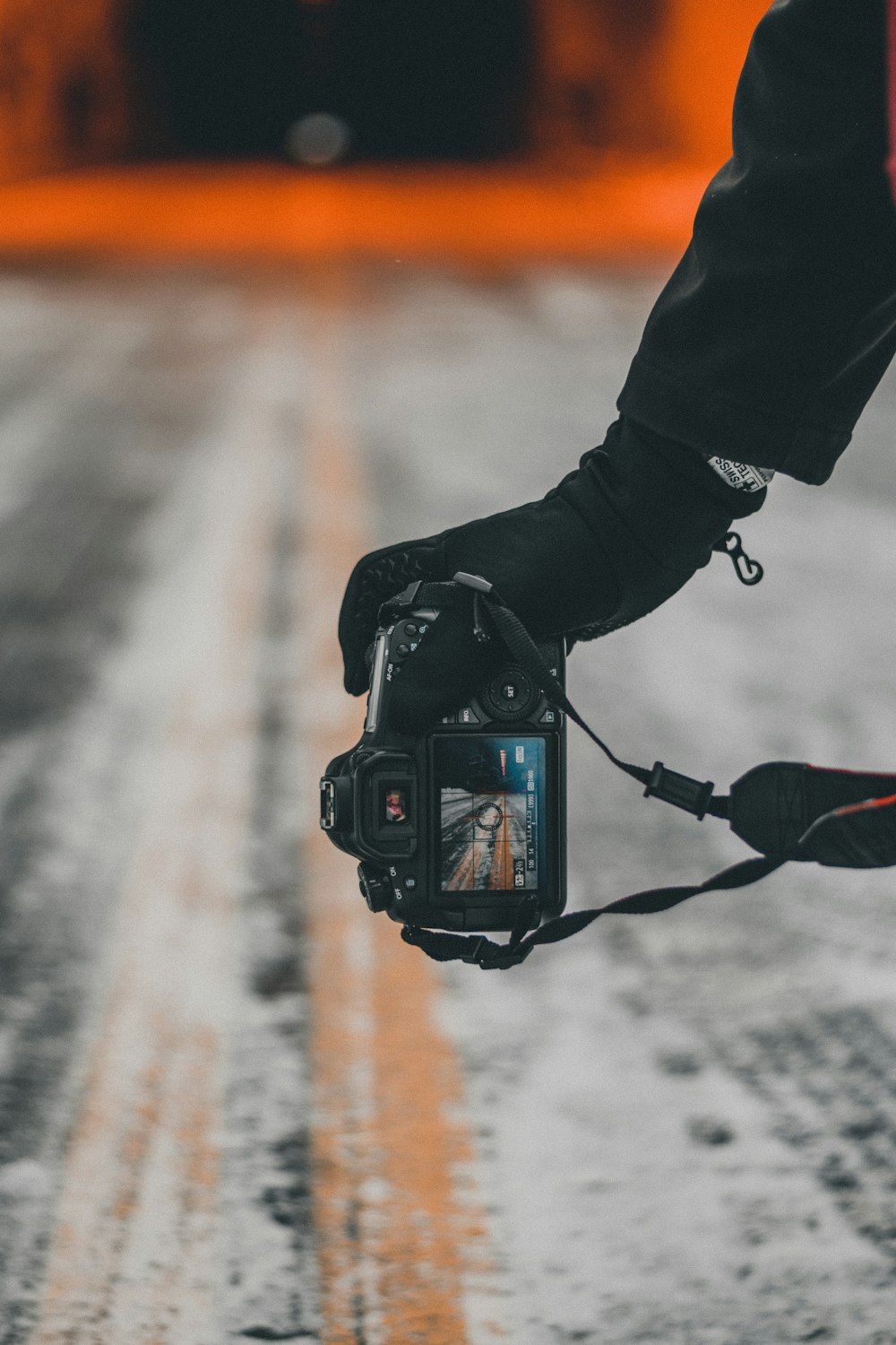 person holding black dslr camera