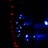 A string of bright blue LED lights arranged in a pattern, with smaller red lights forming a line to the left. The scene is dark, emphasizing the vivid glow of the lights against the shadowy background.