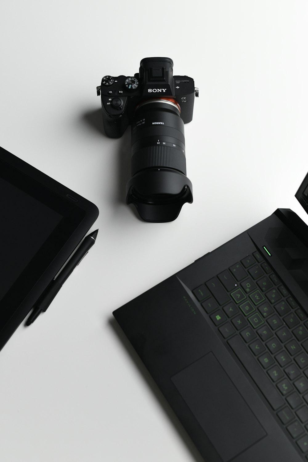 black nikon dslr camera on black laptop computer