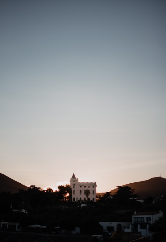 white concrete building under blue sky during daytime in Cadaqués Spain