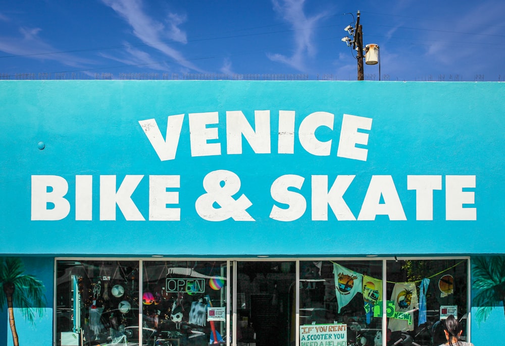 a blue store front with a sign that says venice bike and skate