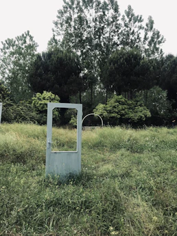 white wooden frame on green grass field