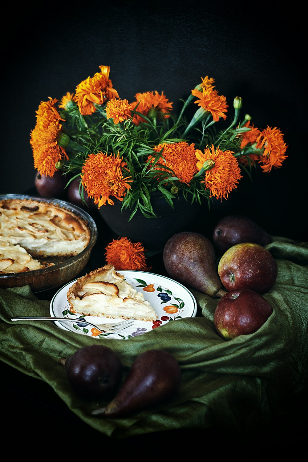 orange and green flowers on brown wooden round tray