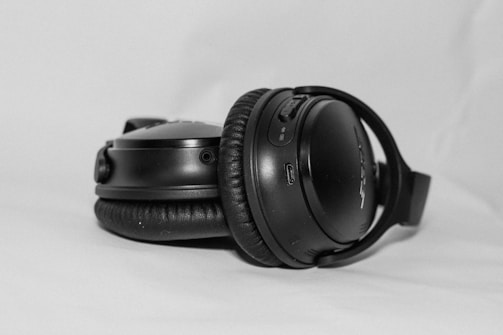 A stylish pair of headphones from Amazon with a subtle 'Share' button graphic.