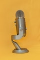 gray microphone on yellow textile