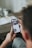 person holding black iphone 4