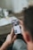 person holding black iphone 4