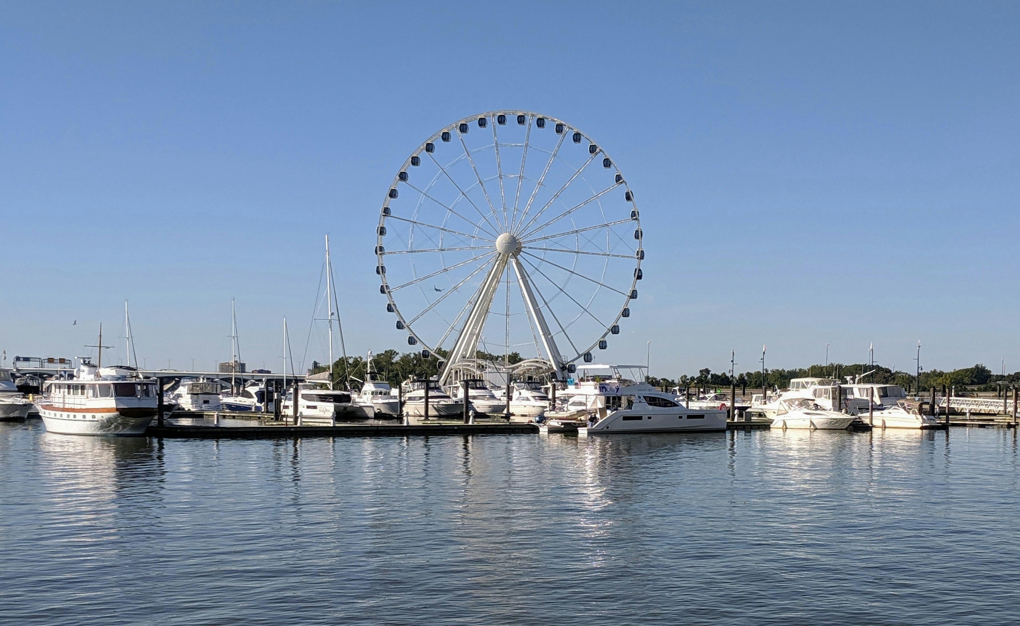 Navy Pier’s 200-foot Centennial Wheel reflecting in the water - Summer activities Chicago