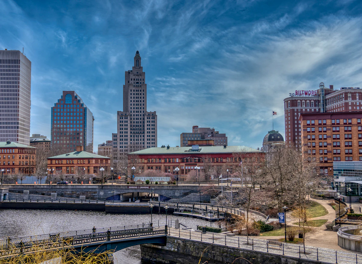 Providence city skyline under blue sky and white clouds