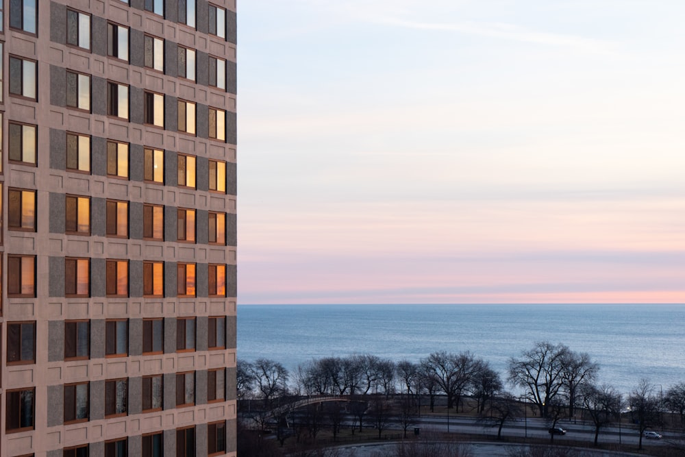 brown concrete building near body of water during daytime