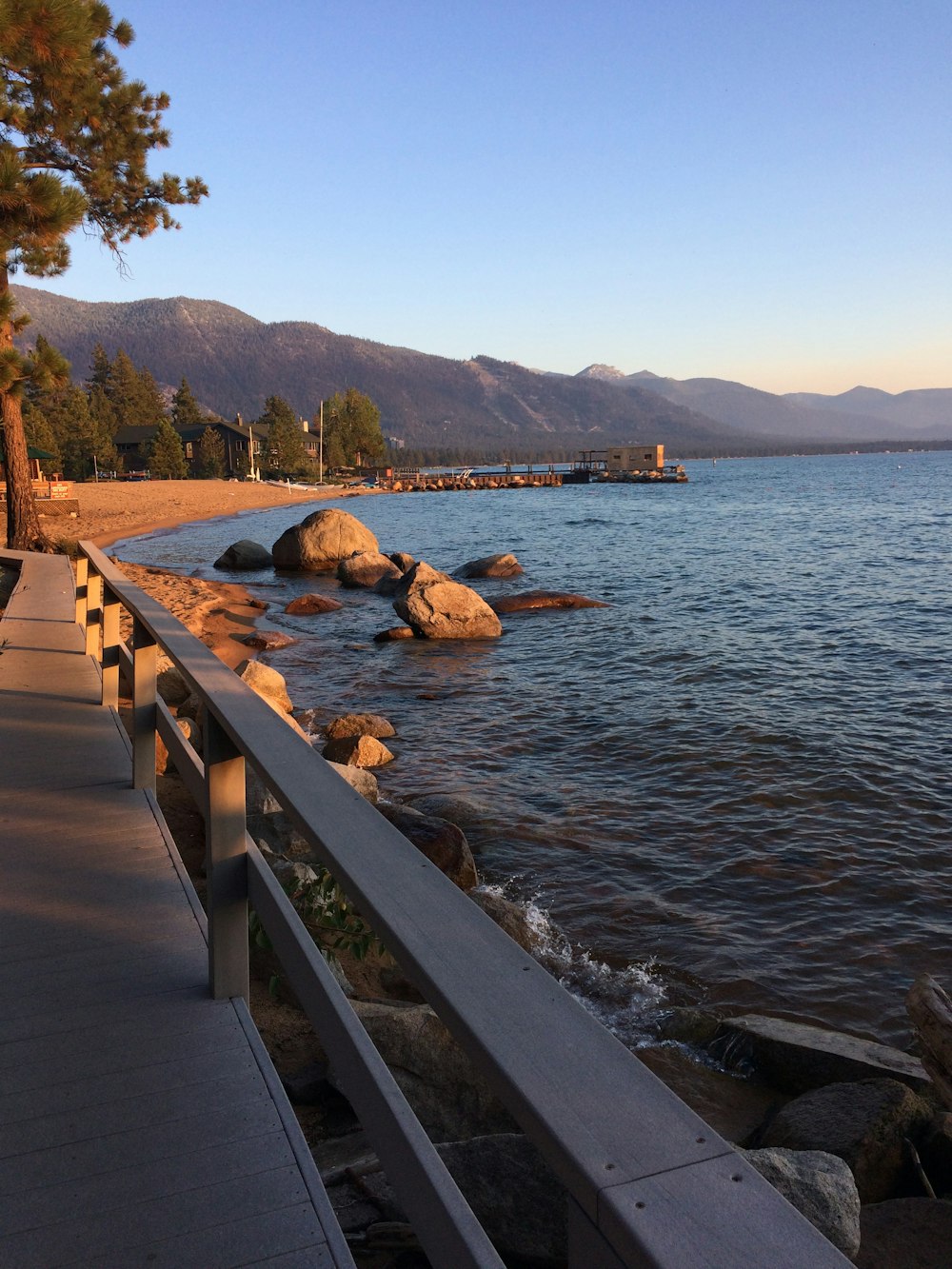 brown wooden dock on body of water during daytime