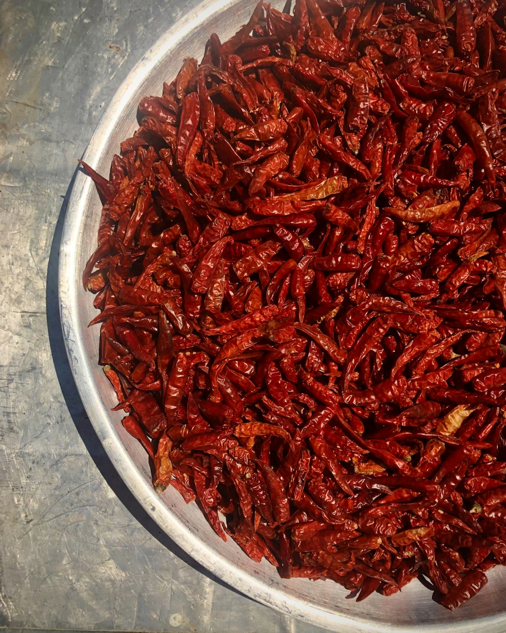 red chili on white round plate