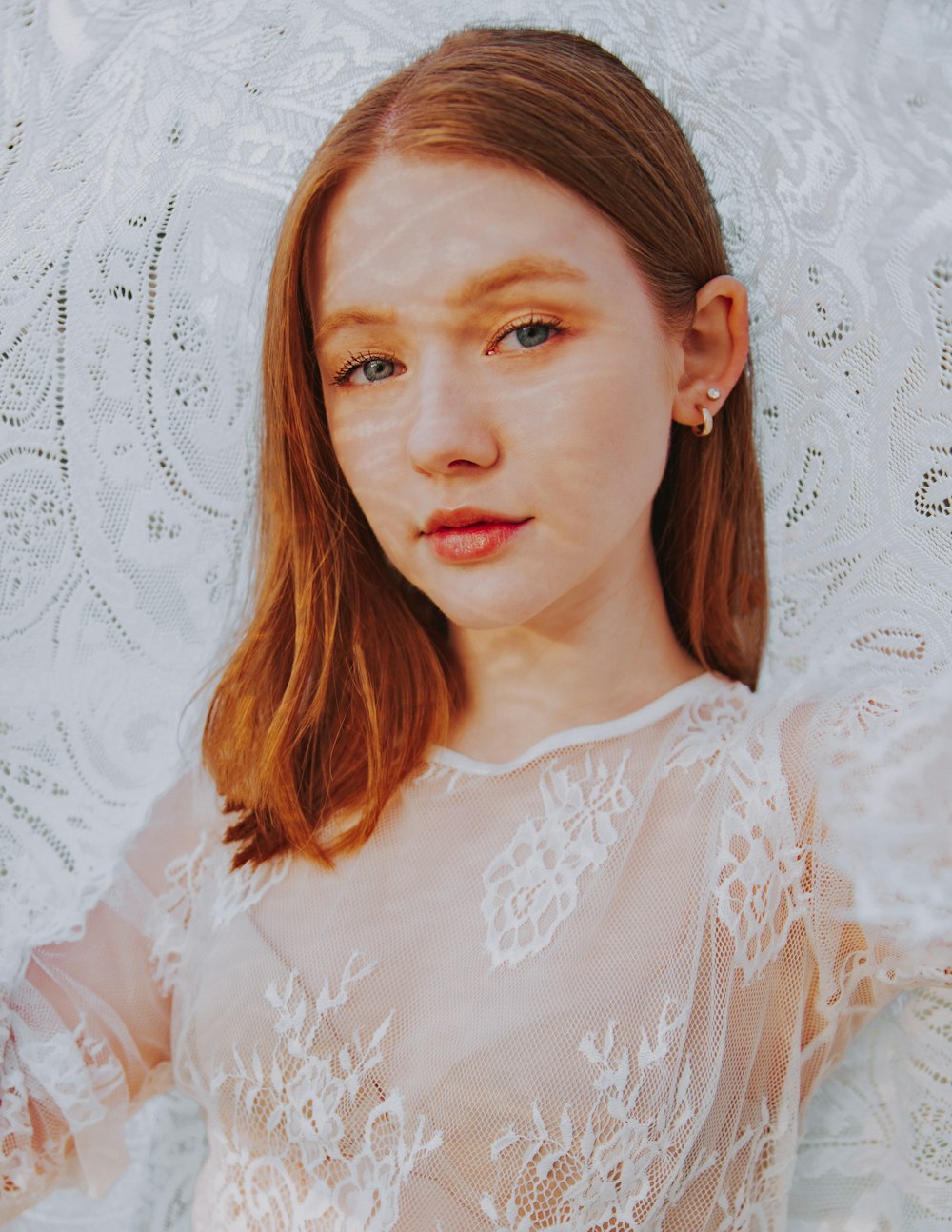 woman in white floral shirt