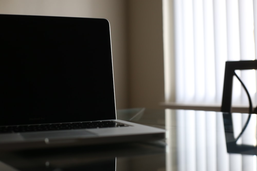 macbook pro on white table